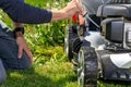 Change and check the oil in the motor lawn mower Royalty Free Stock Photo