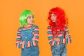 Change color. Kids girls with vibrant hairstyle. Pigment dye hair. Freedom for expression. Fantasy hair trend. Sisters Royalty Free Stock Photo