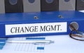 Change Management, blue binder with text in the office Royalty Free Stock Photo