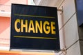 Change means in french text yellow exchange money office on wall entrance facade