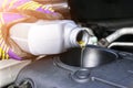 Change the Oil. Hand mechanic in repairing car. Close up oil for car engine. Motor oil pouring to car engine. Refuelling and pouri Royalty Free Stock Photo