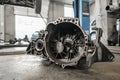 Change and repair clutch, drive axle. working underneath a lifted car. Professional mechanic work maintenance car