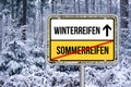 Change summer tires to winter tires street sign. Von Sommerreifen auf Winterreifen wechseln Schild. Royalty Free Stock Photo