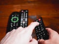 Change television channel with finger in remote control Royalty Free Stock Photo
