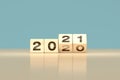 Change 2020 to 2021 happy new year concept - wooden cubes