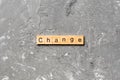 CHANGE word written on wood block. CHANGE text on cement table for your desing, concept Royalty Free Stock Photo