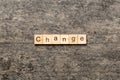 CHANGE word written on wood block. CHANGE text on cement table for your desing, concept Royalty Free Stock Photo