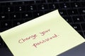 Change you password hand written text on the sticky note kept on the keyboard to improve the network security and escape cyber Royalty Free Stock Photo