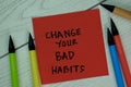 Change Your Bad Habits write on sticky notes isolated on Wooden Table Royalty Free Stock Photo