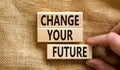 Change your future symbol. Concept words Change your future on wooden blocks on beautiful canvas table canvas background. Royalty Free Stock Photo