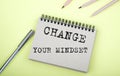 Change Your Mindset text on the notebook with pen on yellow background Royalty Free Stock Photo