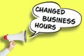 CHANGED BUSINESS HOURS poster or sign with megaphone and speech bubble Royalty Free Stock Photo