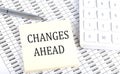 CHANGES AHEAD - business concept, message on sticker on chart background