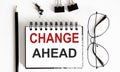 CHANGES AHEAD notepad writing on white background with pencil and glasses Royalty Free Stock Photo