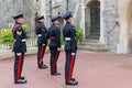 Changing guards with soldiers armed with rifles in Windsor Castle Royalty Free Stock Photo