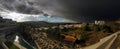 Panoramic view over Spanish village showing thunderstorm approaching