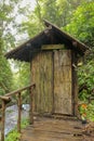 Changing room built of bamboo trunks by a river in a tropical rain forest. Small house at Spray Waterfall on Bali Island high in