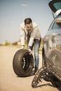 Changing tire on broken car on road Royalty Free Stock Photo