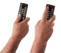 Changing TV program: close up of human hand holding television remote control isolated on white background Royalty Free Stock Photo