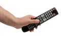 Changing TV program: close up of human hand holding television remote control isolated on white background Royalty Free Stock Photo