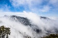 Changing weather with fog rising up from the valley, Mount San Antonio Mt Baldy, south California