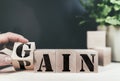 Changing word PAIN to GAIN on wooden blocks