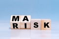 Changing word from Risk To Mask on wooden cubes - making choices during Covid-19 pandemic Royalty Free Stock Photo