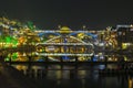 Changsha, China Feb 20,2014 night of FengHuang village illumination lights of main bridge reflect on a river