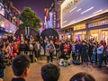 Unacquainted street performers singing at huangxing walking street in Changsha city China.