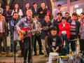 Unacquainted street performers singing at huangxing walking street in Changsha city China