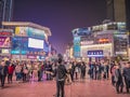 Unacquainted street performers singing at huangxing walking street in Changsha city China