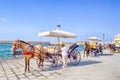 Chania, Crete - August 20, 2018: One of the Chania`s Tourist Attractions with Horse Riding and Classic cabs in Chania