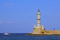 Chania, Crete, 01 October 2018, View of the lighthouse and a boat in the port of Chania