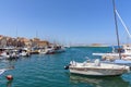 Chania harbour with yachts and fishing boats on Crete island.