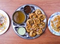 channa papri chat masala, dahi baray and pani puri or gol gappay with raita, sweet sauce and spicy water served in dish isolated
