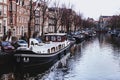 Channel in Amsterdam Netherlands Boat houses river european city landscape Royalty Free Stock Photo