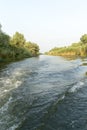 Channel landscape with waves in Danube Delta, Romania, on summer day