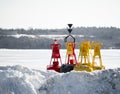 Channel Marker Bouys stored on shore winter Royalty Free Stock Photo