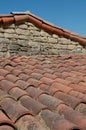 old canal tile roof with stone chimney