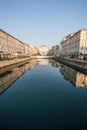 Channel Trieste with reflection over the ancient buildings. Adriatic Sea. Italy