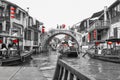 Zhujiajiao, ancient village with traditional canal with wooden boats and ancient bridge near Shanghai, China. Black, white, red Royalty Free Stock Photo