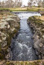 Channeled water flowing from a weir