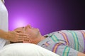 Channeling Reiki Energy to male patient Royalty Free Stock Photo