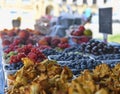 Chanterelles or girolle mushrooms and other fruit and vegetables for sale at local farmers market. Fresh organic produce Royalty Free Stock Photo