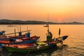 Chanthaburi, Thailand - February, 02,  2020 :Beautiful sunrise over sea with Silhouette of fishermen with yellow and orange sun in Royalty Free Stock Photo