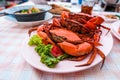 Many bright red steamed sea crabs Lined in a plate ready to serve for those who like to eat seafood.