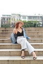 Beautiful Girl Sitting On The Stairs