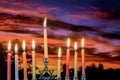 Chanukah Menorah in the Jewish festival of lights beautiful sky with cloud sunset