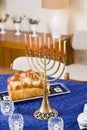 Chanukah menorah lit on table