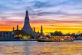 Chao Phraya River Cruise Boat with Temple of the Dawn, Wat Arun, at Sunset in Background, Horizontal